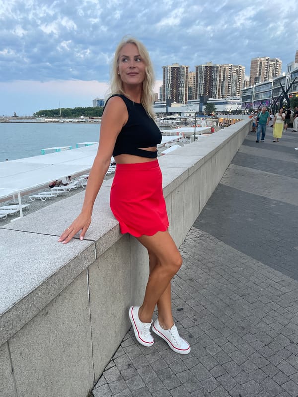 Novorossiysk beach afternoon: swimmers, cabanas, and a seaside selfie
