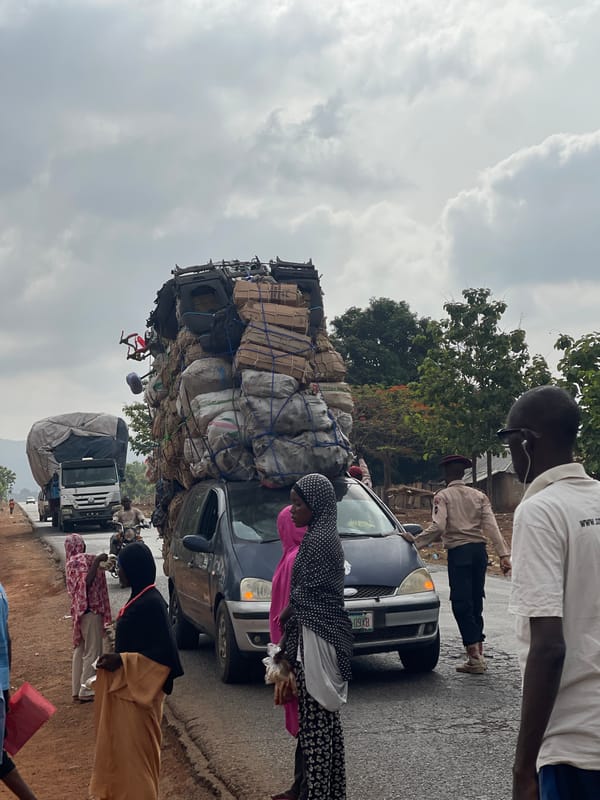 Overloaded sedan carries towering cargo in Gidan Waya, Nigeria