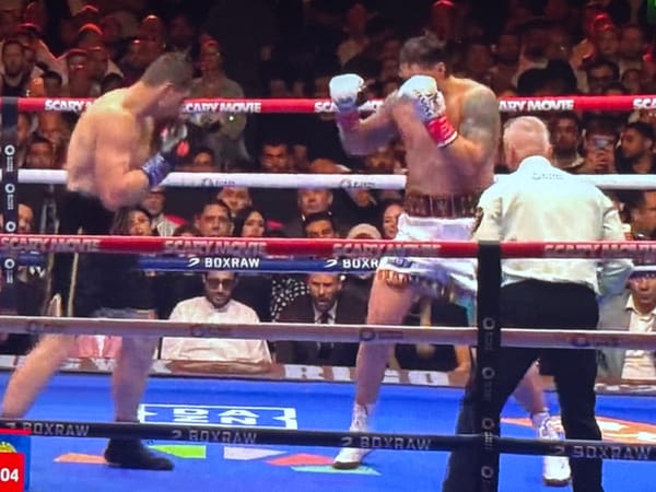 Boxing match held in Łódź with referee overseeing bout