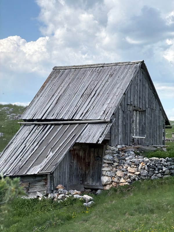 Weathered wooden barn spotted on Montenegro hillside
