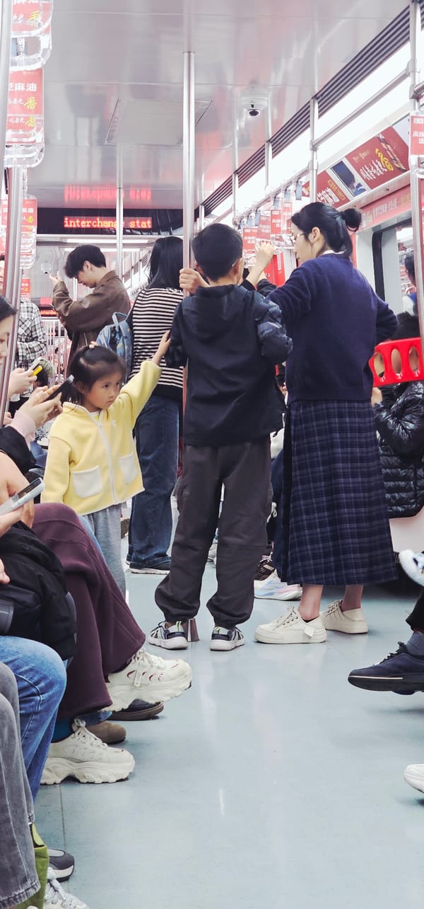 Passengers ride subway during daytime service in Yuzhong District