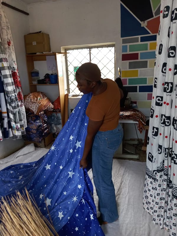 Cutting and sewing star-print fabric in a small workshop