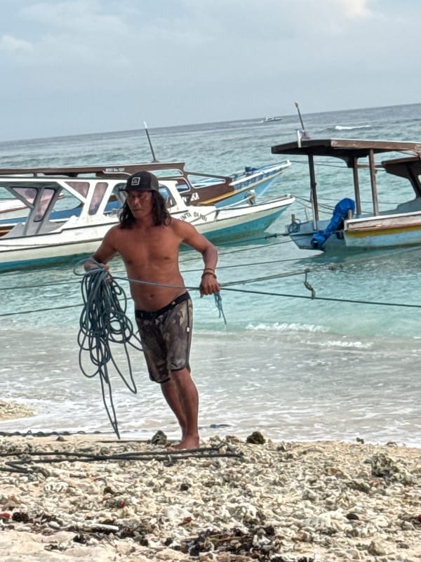 Man with rope observed on Indonesian beach
