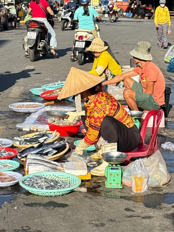 Nha Trang street market in full swing — fish, produce, and traffic