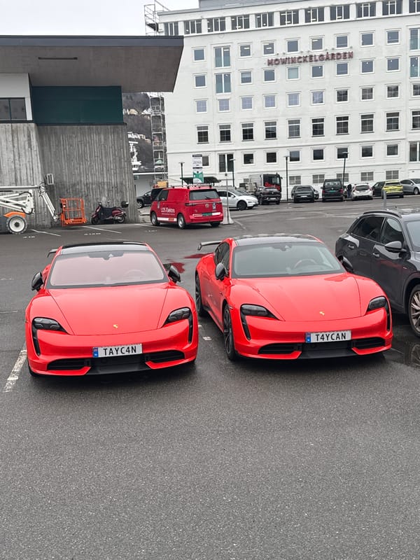 Twin red Porsche Taycans spotted with matching plates in Bergen