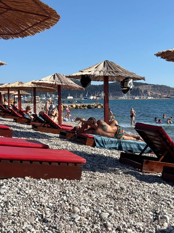 Busy summer afternoon on Bar's pebble beach, Montenegro