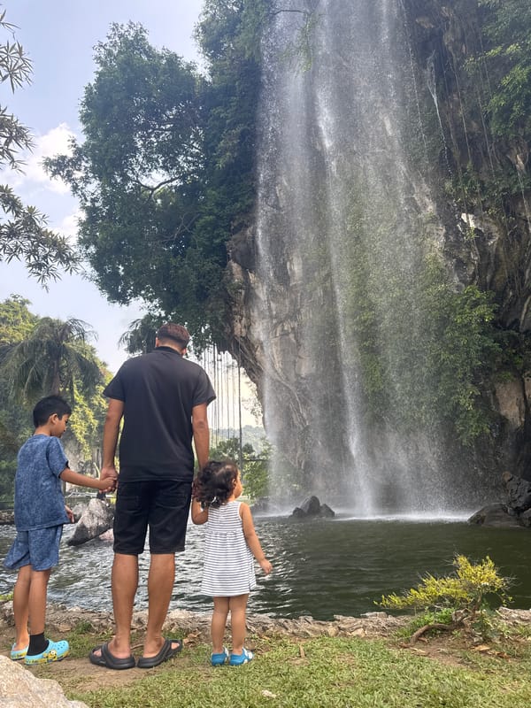 Tourists capture waterfalls at Ipoh recreational parks and temples