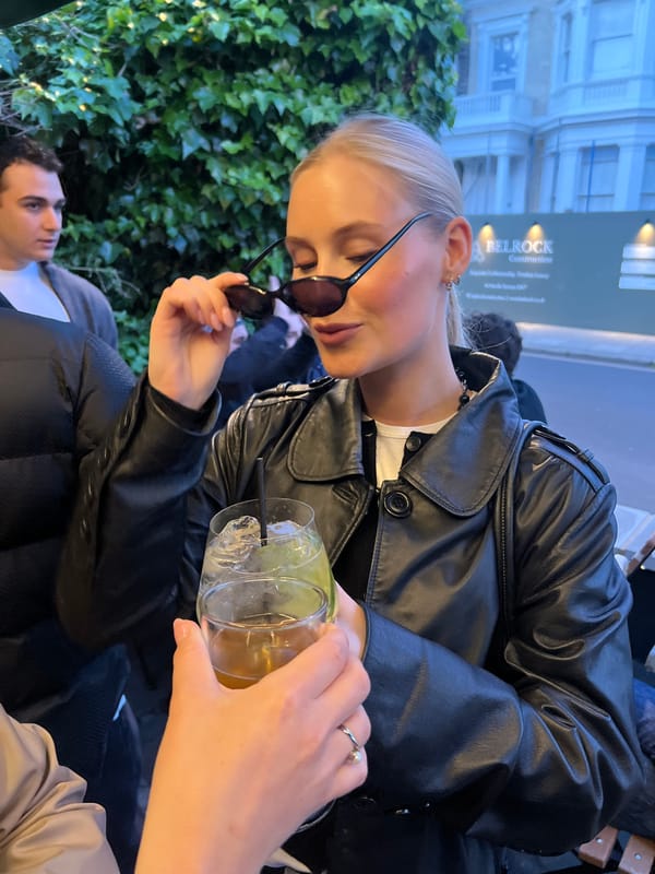 Two women photographed with drinks at London venue