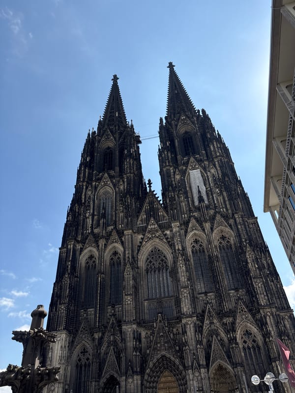 Cologne Cathedral's twin spires against a clear sky