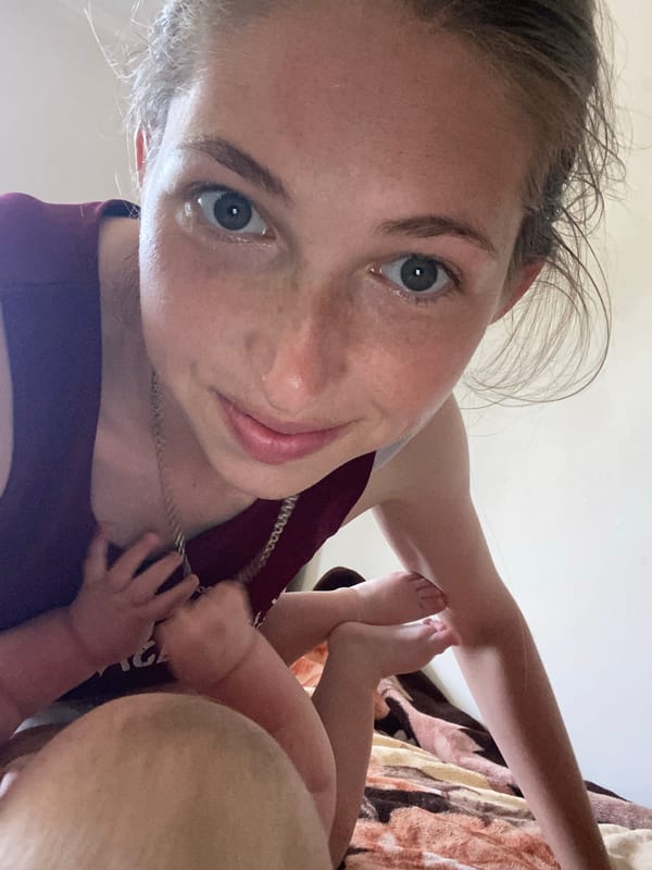 Quiet moment at home with a baby on a patterned blanket