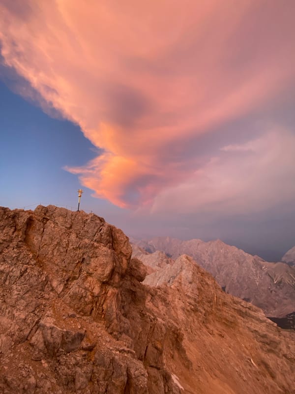 Zugspitze summit at golden hour, cross and dome in frame