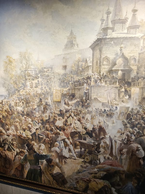 Museum visitor views traditional Russian paintings in Nizhny Novgorod