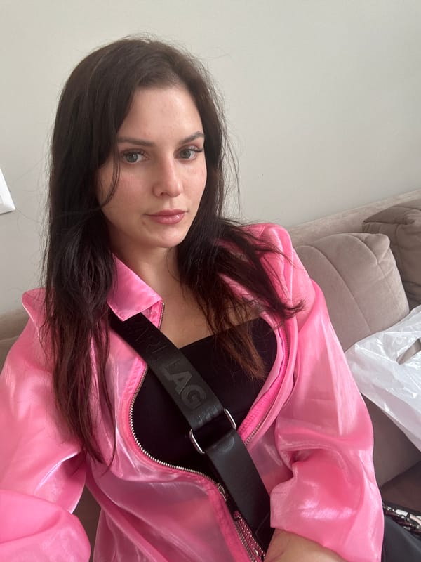 Selfie session in Novoselye featuring a pink jacket and blue shoe covers