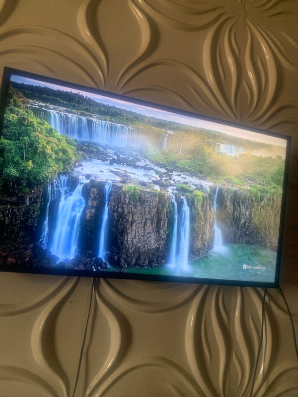 Television displays Microsoft Bing waterfall screensaver or wallpaper image
