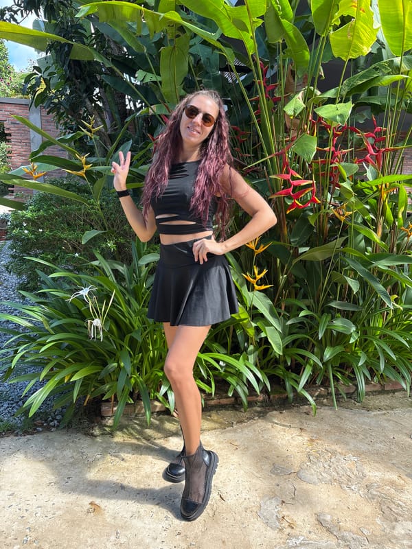 Tropical garden and motorcycle hangout with a small dog