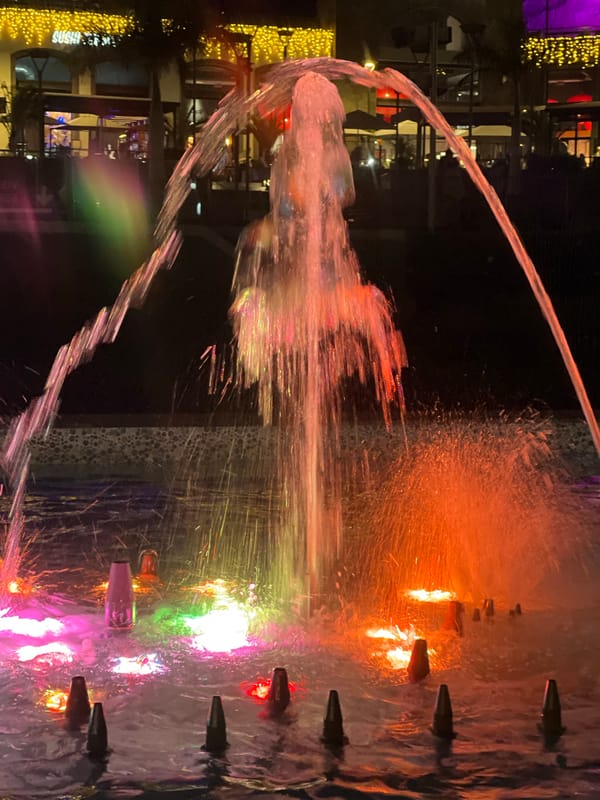 Colorful illuminated fountains light up Spanish resort town