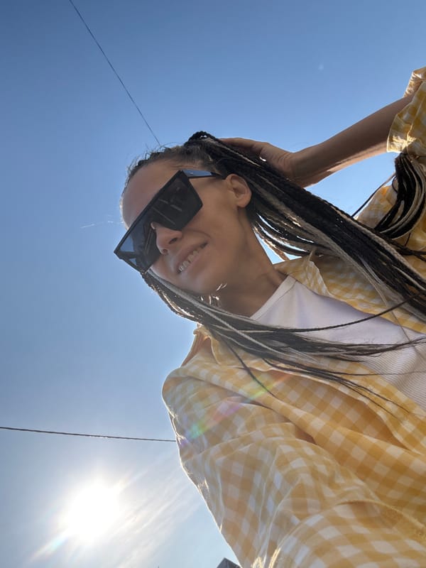 Person in checkered shirt photographed across Russian villages