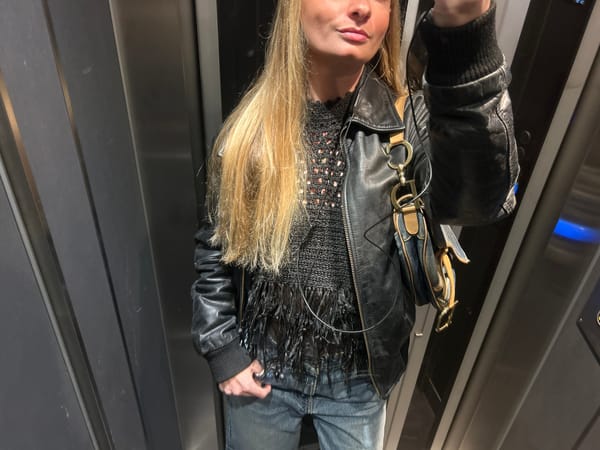 Person in black leather jacket observed in indoor spaces