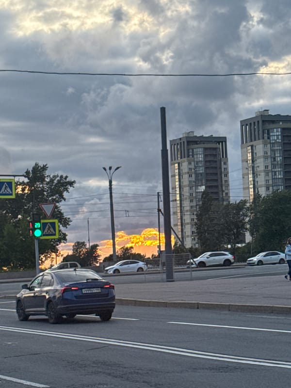 Saint Petersburg street at golden hour under dramatic skies