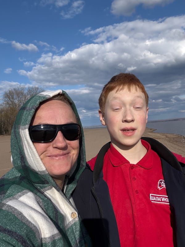 Family enjoys beach day with dog in Noviy, Russia