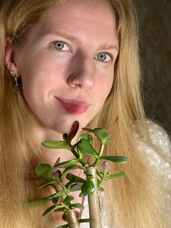 Woman drinks amber beverages in snowy Izhevsk residential area
