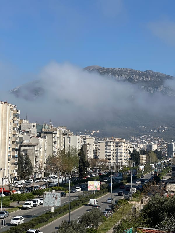 Morning fog blankets Bar, Montenegro mountains; hearts shared