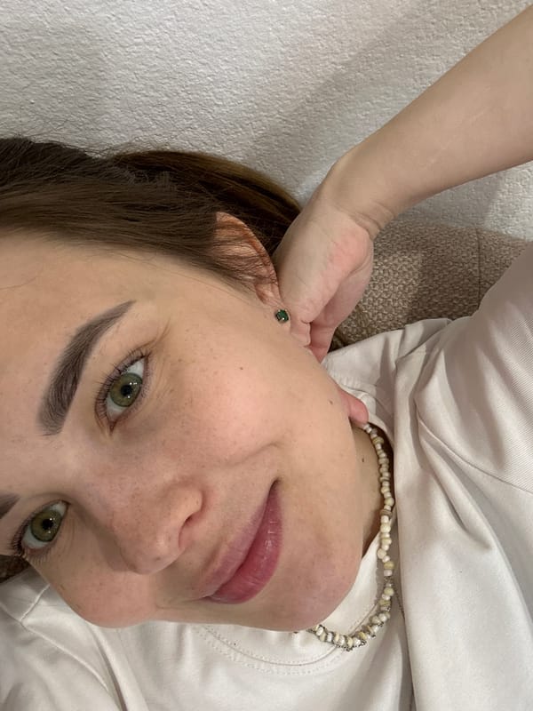 Young person takes morning selfie on sofa in Perm