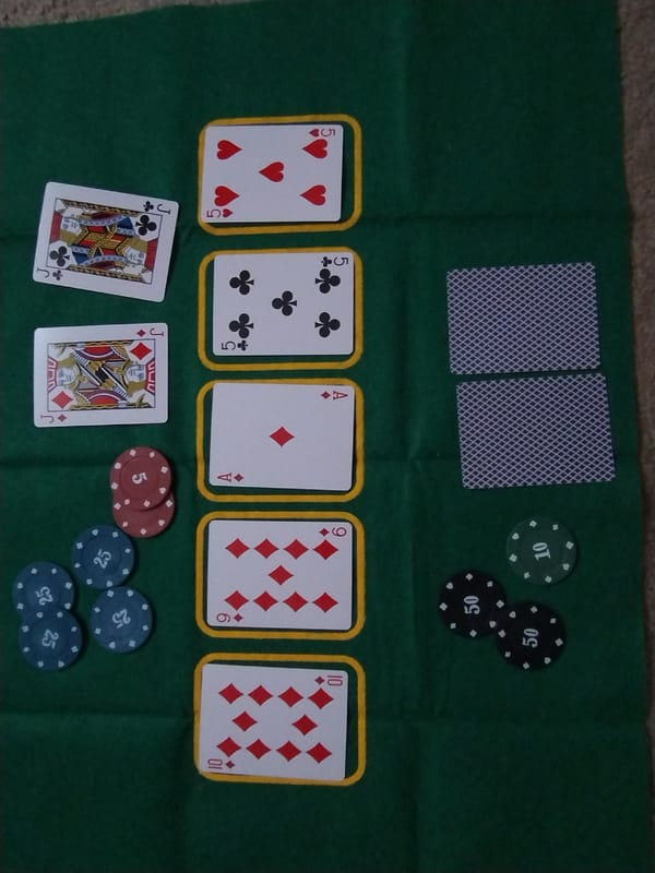 Home poker setup with a curious black cat nearby