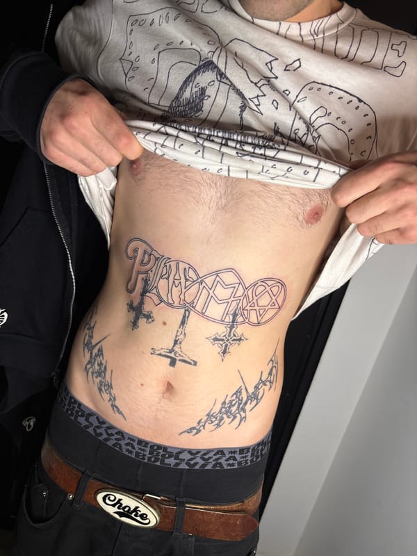 Person displays mixed religious, symbolic tattoos in Buenos Aires