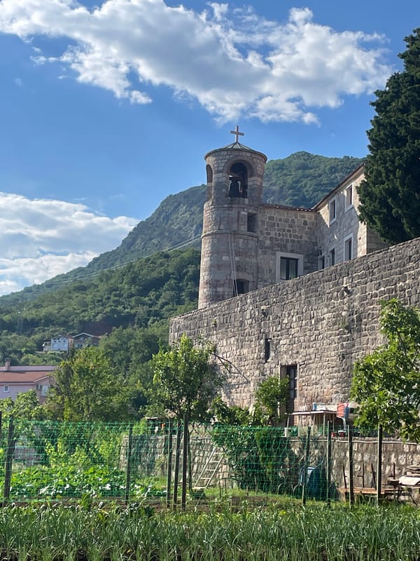 Tourist documents Montenegro's historic churches and architecture in Budva