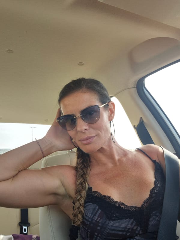 Woman reclining in vehicle observed during daytime hours