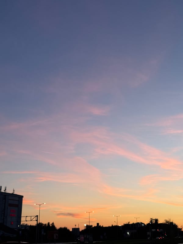 Sunset church towers and work-life reflection captured in Bar