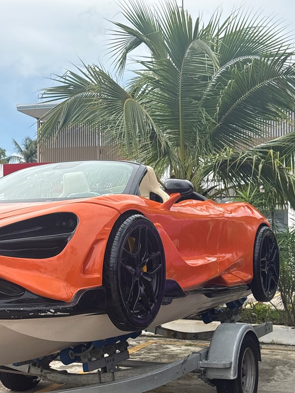 Two McLaren supercars on a trailer turn heads in Rawai