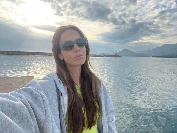 Tourist photographed at scenic coastal pier in Bar, Montenegro