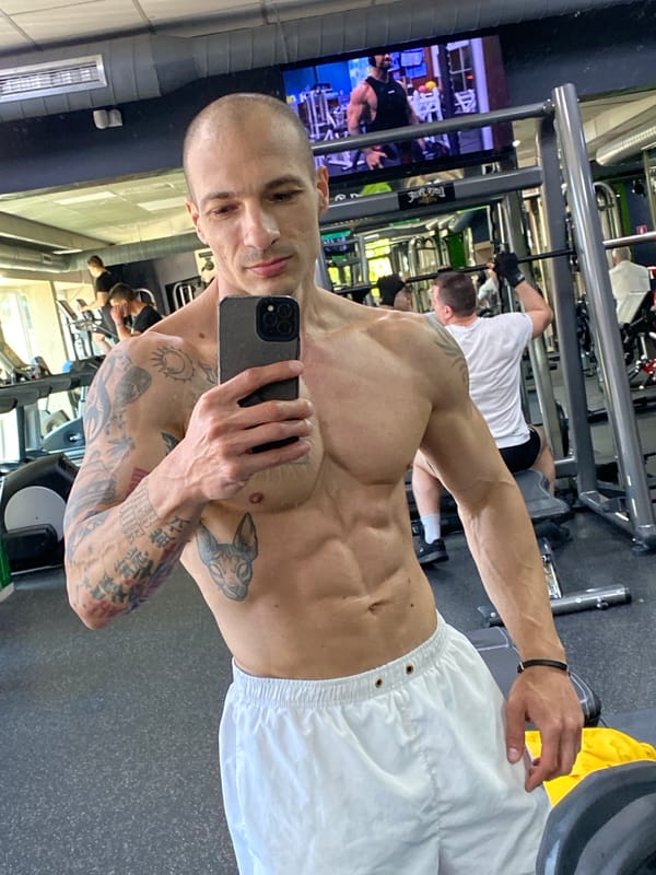 Tattooed man takes gym selfie in Pleven, Bulgaria