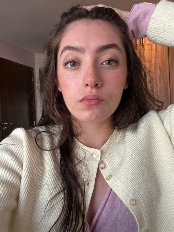 Woman documents makeup routine and outfit changes in Mexico bedroom