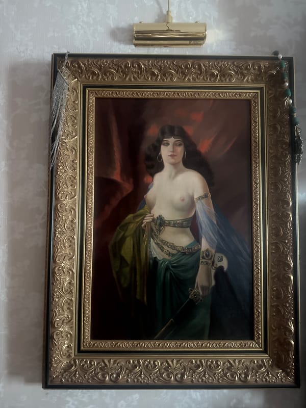 Ornate painting of reclining woman observed on Moscow wall