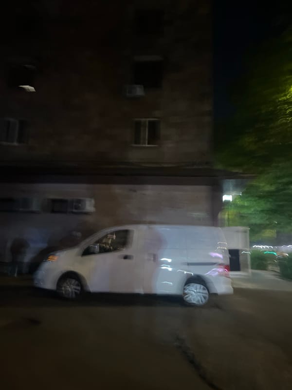 White van parked on Yerevan street during evening hours