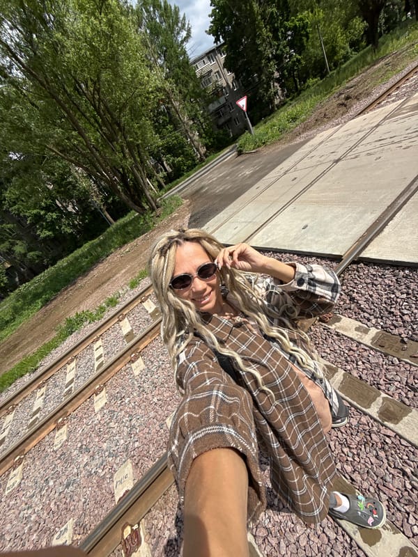 Woman and child photographed during outdoor session near tracks