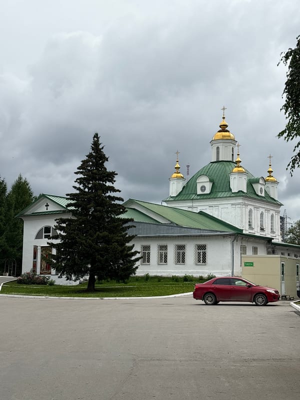 Perm's Orthodox cathedrals and garden details on a cloudy morning