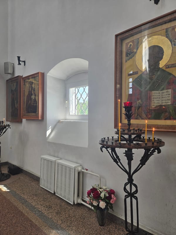 Church interior with icon and chandelier documented in Dolgoprudny