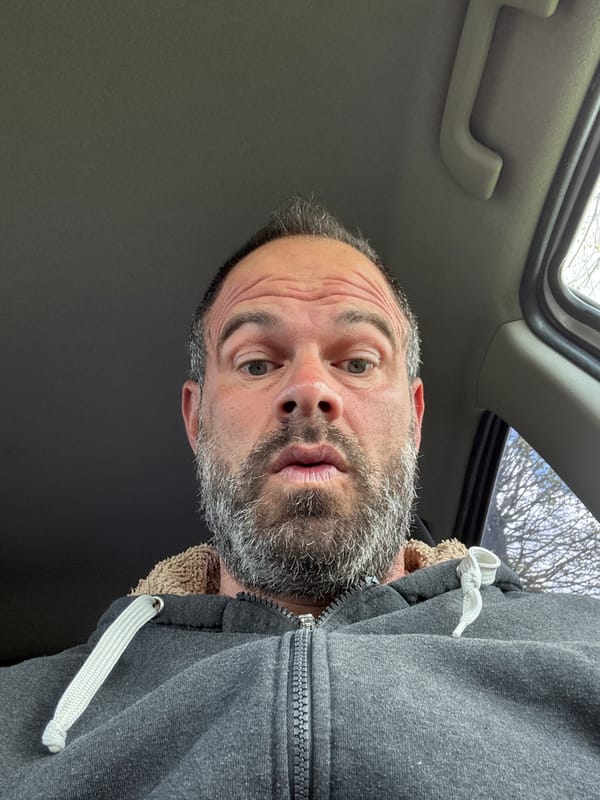 Man takes selfie in vehicle in Marche-en-Famenne, Belgium