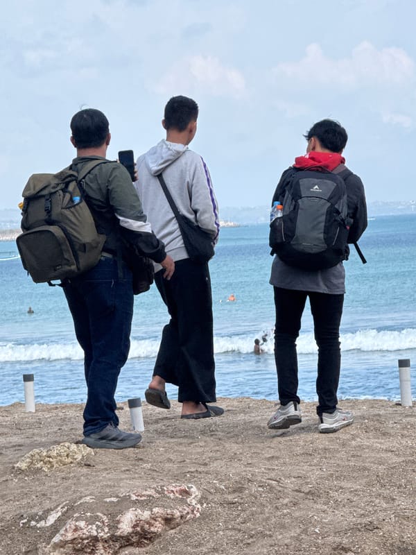 Kuta Beach surf session on a cloudy July morning