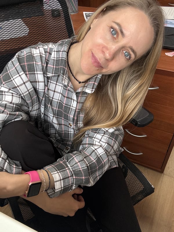 Woman photographed at office workspace in Chaikovsky, Russia