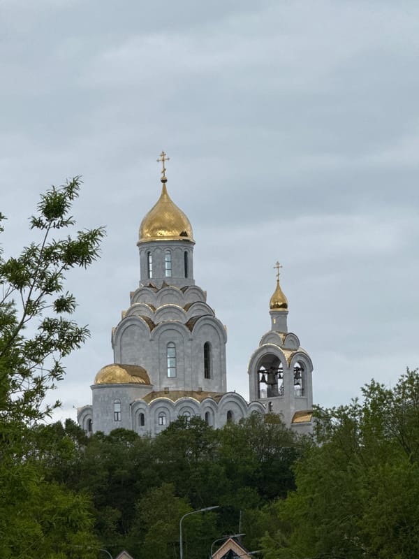 Overcast waterfront visit near an Orthodox church in Kamchatka