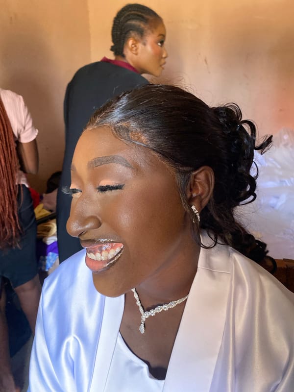 Woman receives makeup styling session in Kuru Karama, Nigeria