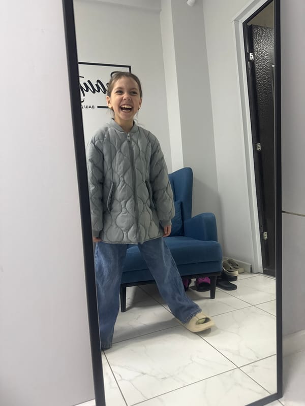 Woman photographs herself indoors in Votkinsk residence