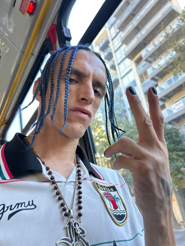 Person with blue braids photographed on Buenos Aires bus