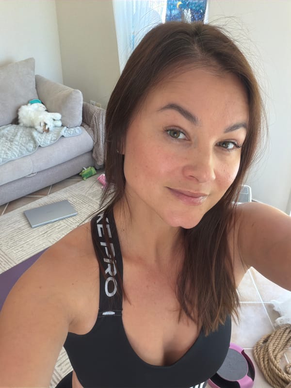 Woman takes selfie in athletic wear in Montenegro home