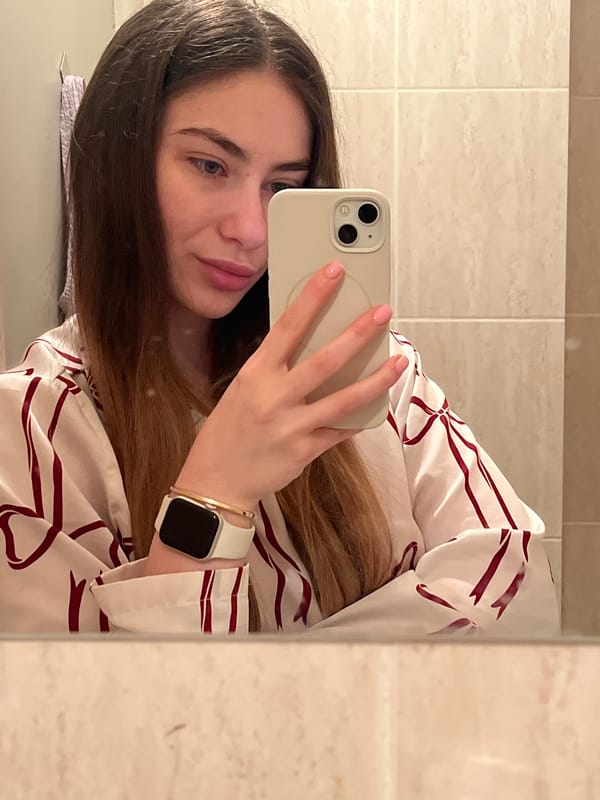 Woman Takes Bathroom Selfie Near Arranged Food Items